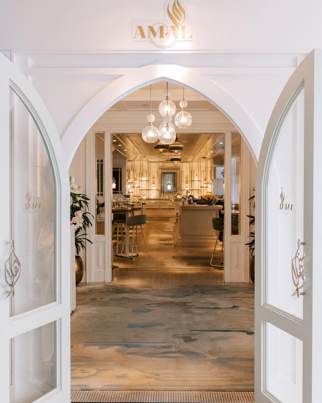 The arched entrance and glass doors at Amal Yorkville
