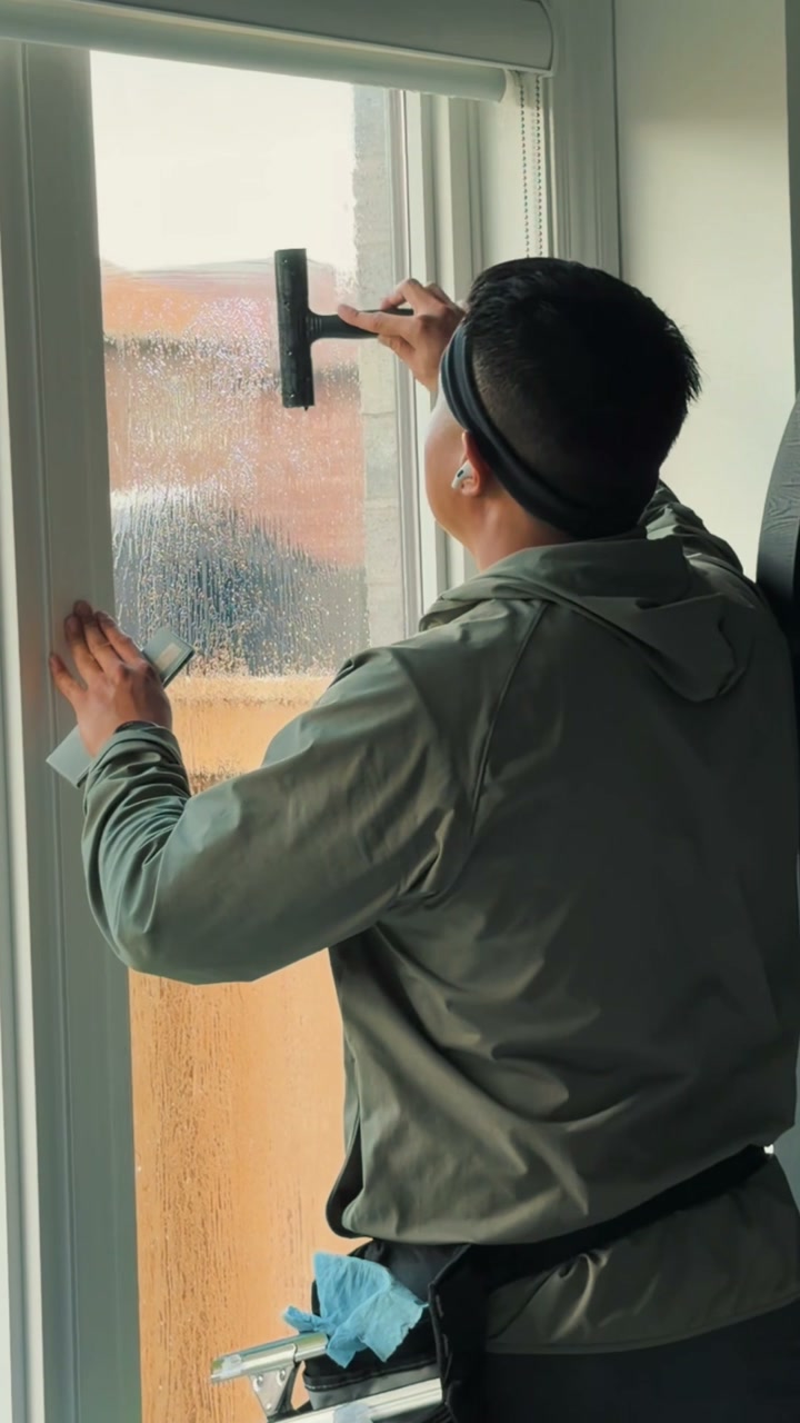 Blackridge fitting window film to the glass of a residential entrance